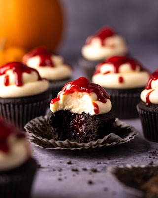 Halloween black cupcakes decorated with red jam