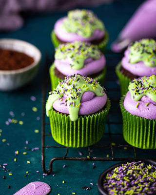 Halloween cupcakes topped with purple icing 