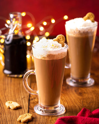 gingerbread latte topped with whipped cream and shot next Whitworths Molasses sugar bag 