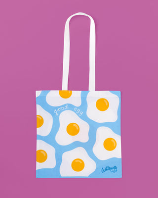 Tote bag with fried egg design on a purple background
