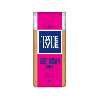 A 3kg bag of Tate & Lyle Light Brown Soft Puree Cane Sugar, featuring a bright pink and navy blue label with the brand logo and product details, set against a plain white background.