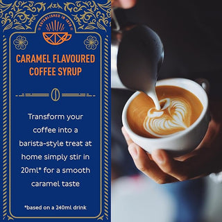 A hand pours frothy milk from a metal jigger into a frothy latte