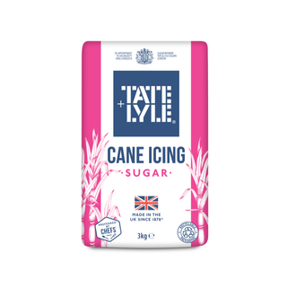 A 3kg bag of Tate & Lyle Cane Icing Sugar, featuring a white and pink package design with a prominent blue brand logo block in the center.